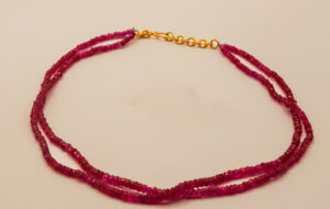 red coloured ruby beads necklace with double strands and a golden hook